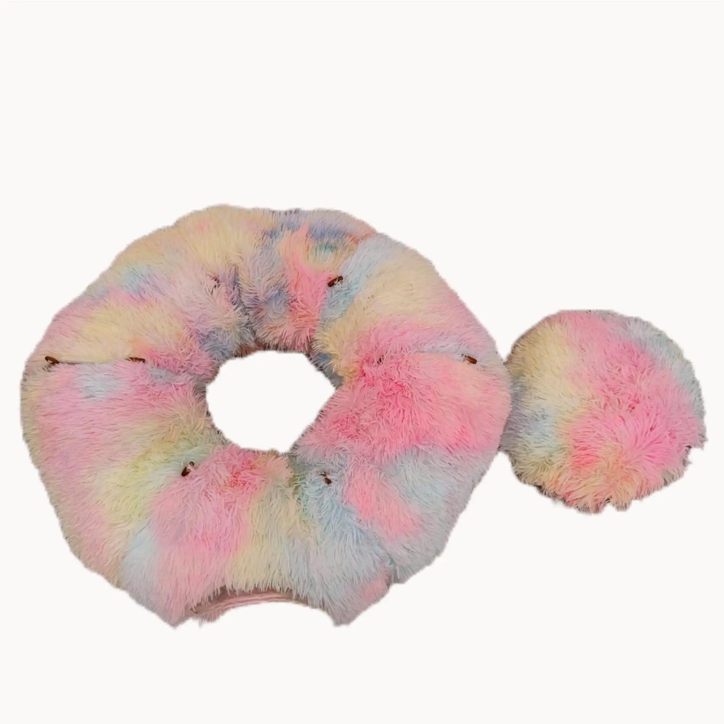 Multicolored scrunchie with pom-pom on a white background